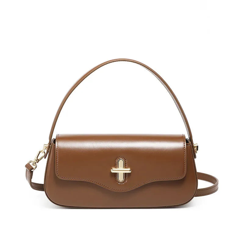Genuine leather women's baguette handbag with lock detail and double shoulder straps