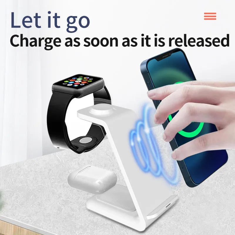 White upright wireless charging stand holding a mobile phone, with a smartwatch and earbuds case charging on its base.