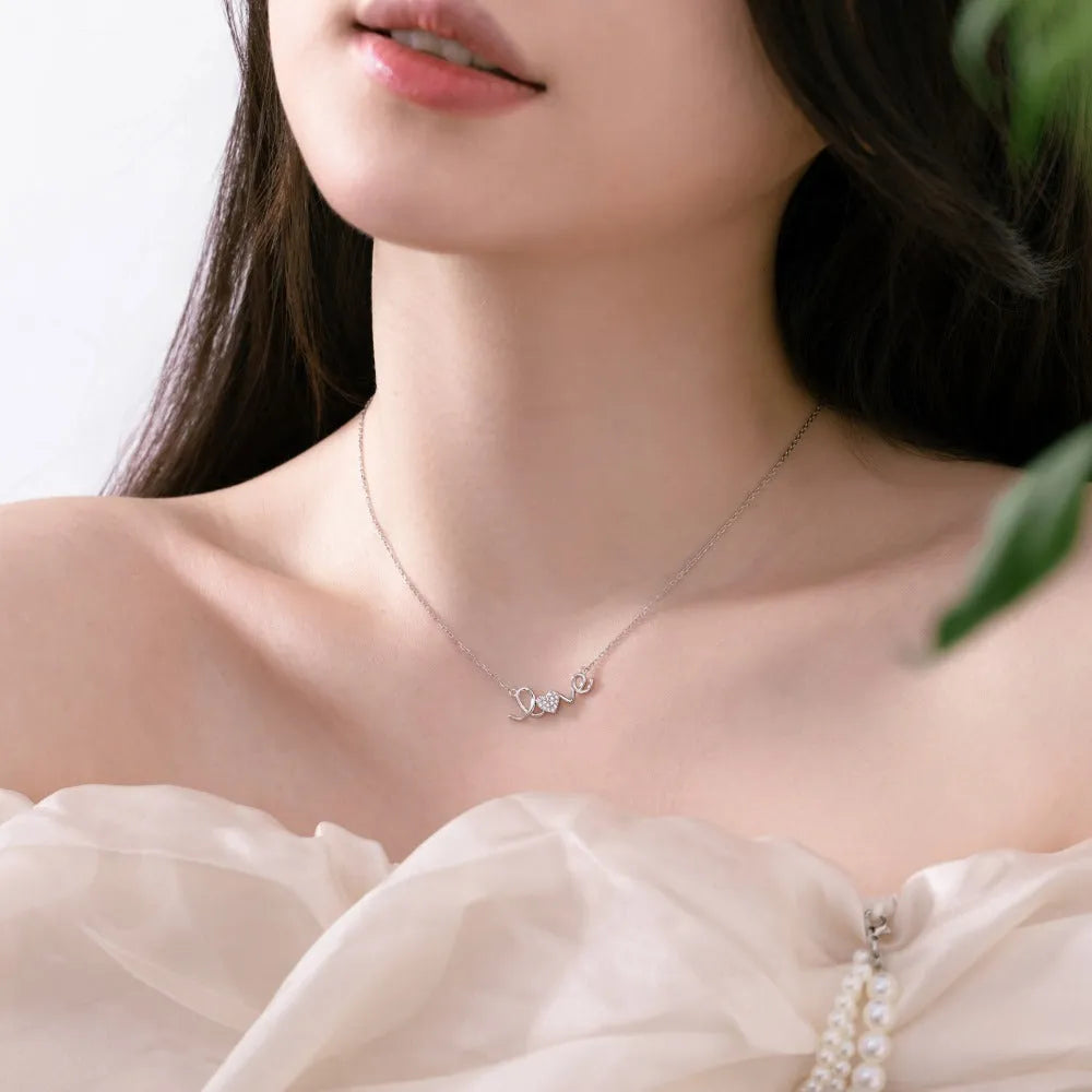 925 sterling silver LOVE pendant necklace for women, platinum finish, on display