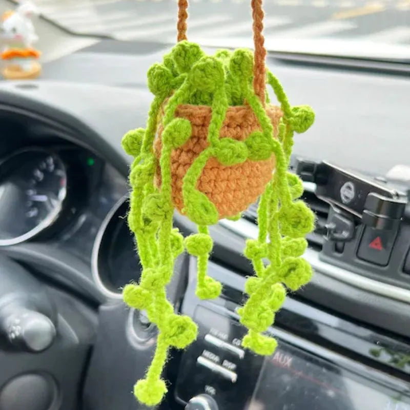 Green and white knitted wool car plant decoration with basin base and hanging rope