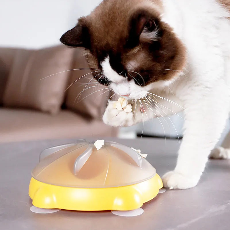Yellow educational cat toy with treat dispensing and snack storage functions