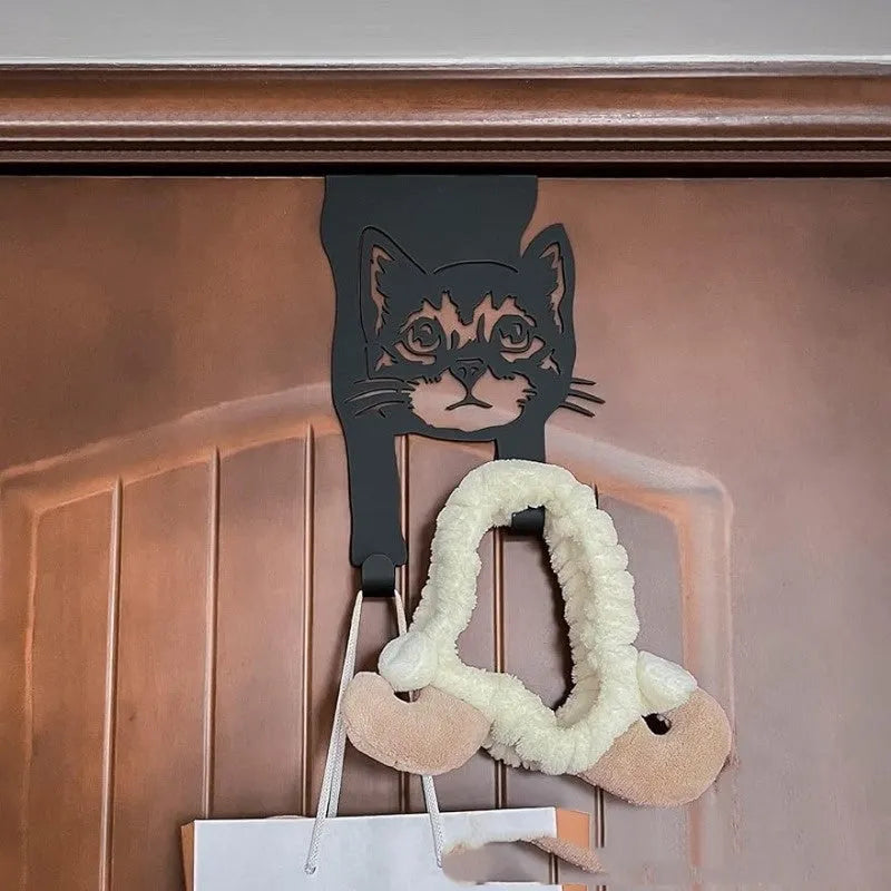 Black iron cat-shaped decorative wall hook for doors and rooms.
