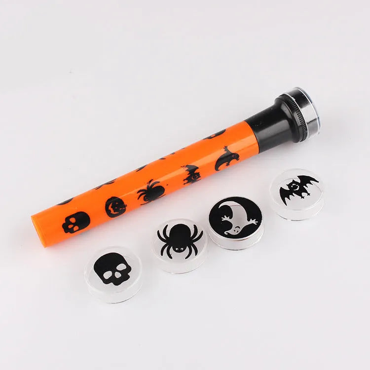 Orange metal pumpkin skull flashlight projection lamp with textured metal finish