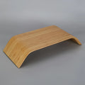 Walnut laptop stability bracket stand in bamboo leather colour on a desk