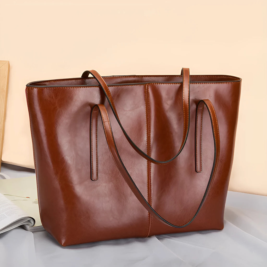 Women's genuine leather shoulder bag with retro styling and multiple internal compartments