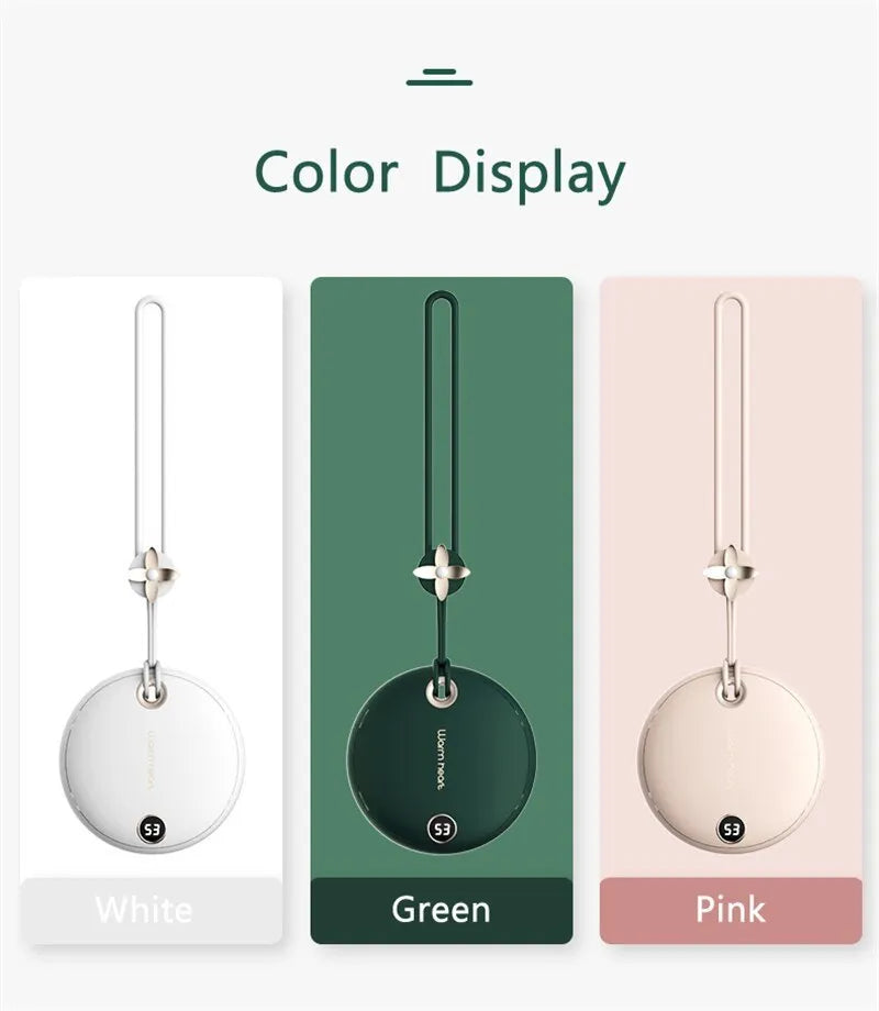 Green 5000mAh power bank hand warmer with digital display shown next to its charging cable.