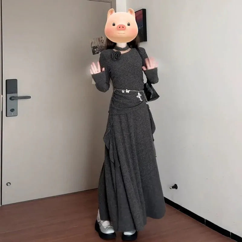 Women's gray knit dress set with neck-hanging top and long patchwork skirt on a model