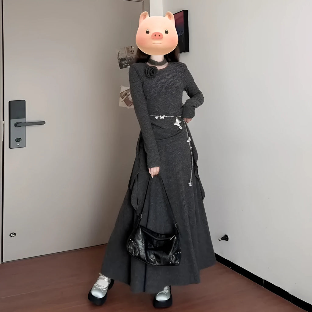 Women's gray knit dress set with neck-hanging top and long patchwork skirt on a model