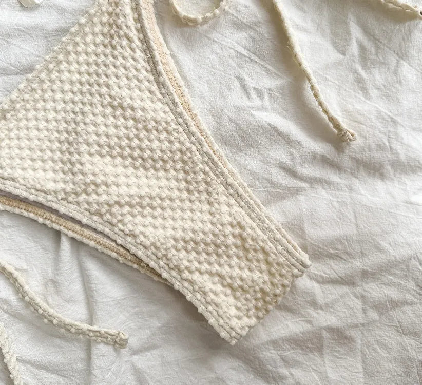 Women's halter lace-up bikini swimsuit in milky white, green, or white, briefs style.