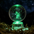 Transparent 6cm crystal ball ornament with inner carving on a fixed base, modern minimalist decor.