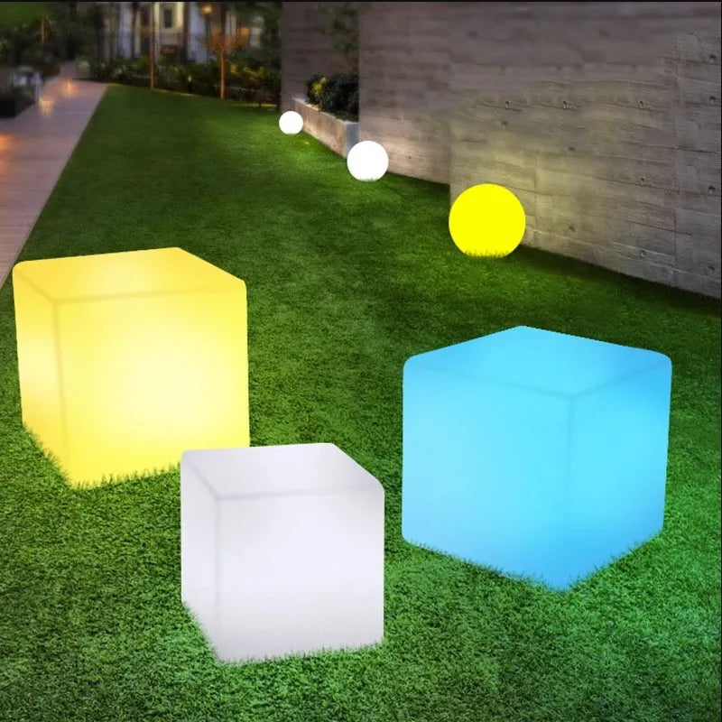 A modern square LED cube light stool for outdoor gardens, available in multiple sizes.