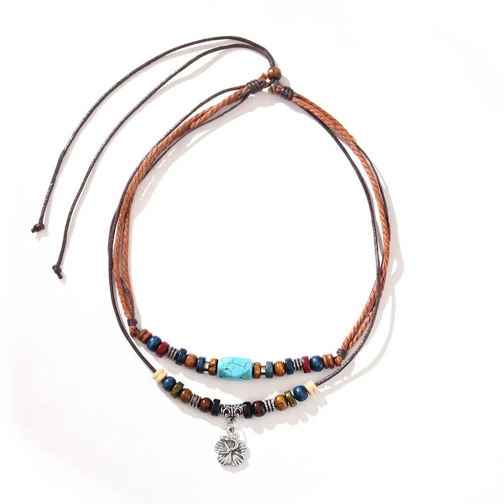 Men's wooden bead necklace with turquoise wax rope and geometric alloy pendant featuring flower details