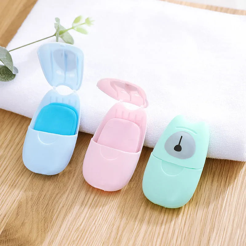 Pack of 50 disposable biodegradable soap paper sheets in pink, blue, and green colours for travel hand cleaning