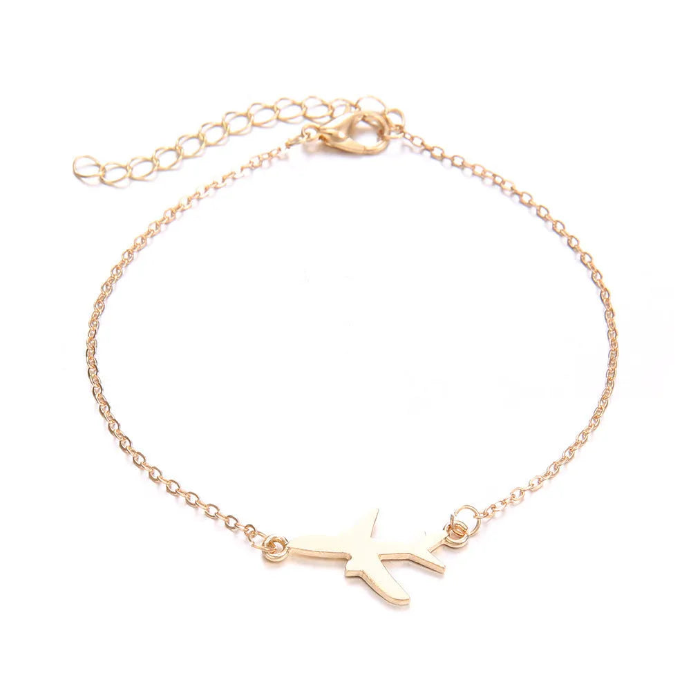 Three silver Bohemian bracelets with heart-shaped charms showing aircraft map details