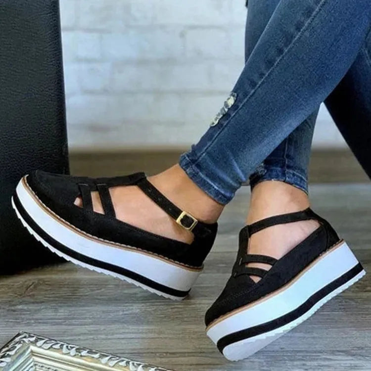 Women’s fashion sandal with buckle strap, chunky sponge cake flat heel, and round toe in black colour