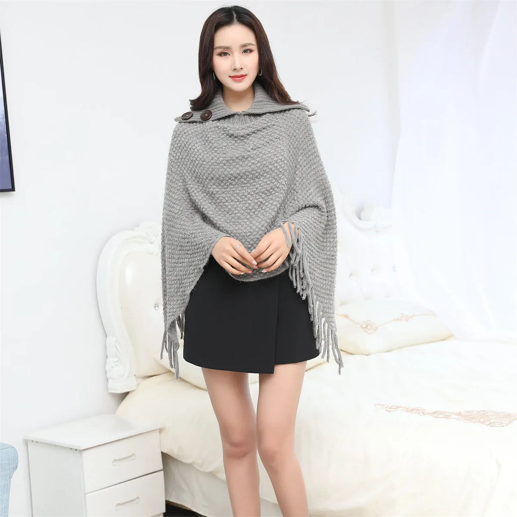 Women's dotted pattern sleeveless knit cloak shawl in acrylic fibre, shown in apricot colour.