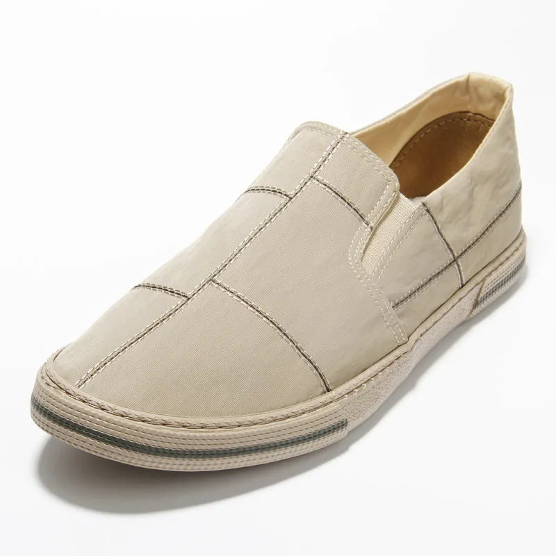 Men's low-top slip-on canvas shoes in multiple colours on a flat rubber sole with a square heel.