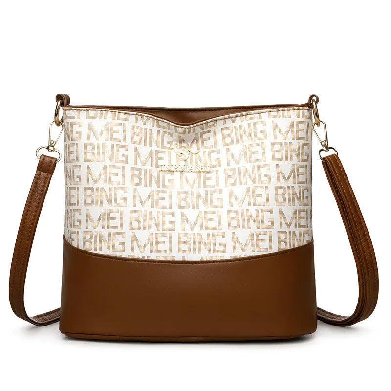 Brown soft PU leather messenger bag with external pocket and organised interior compartments.