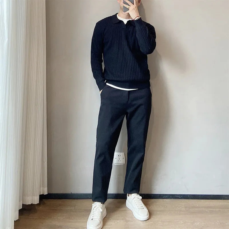 Man wearing a loose grey modal knit pullover sweater with a textured rabbit fur blend fabric.