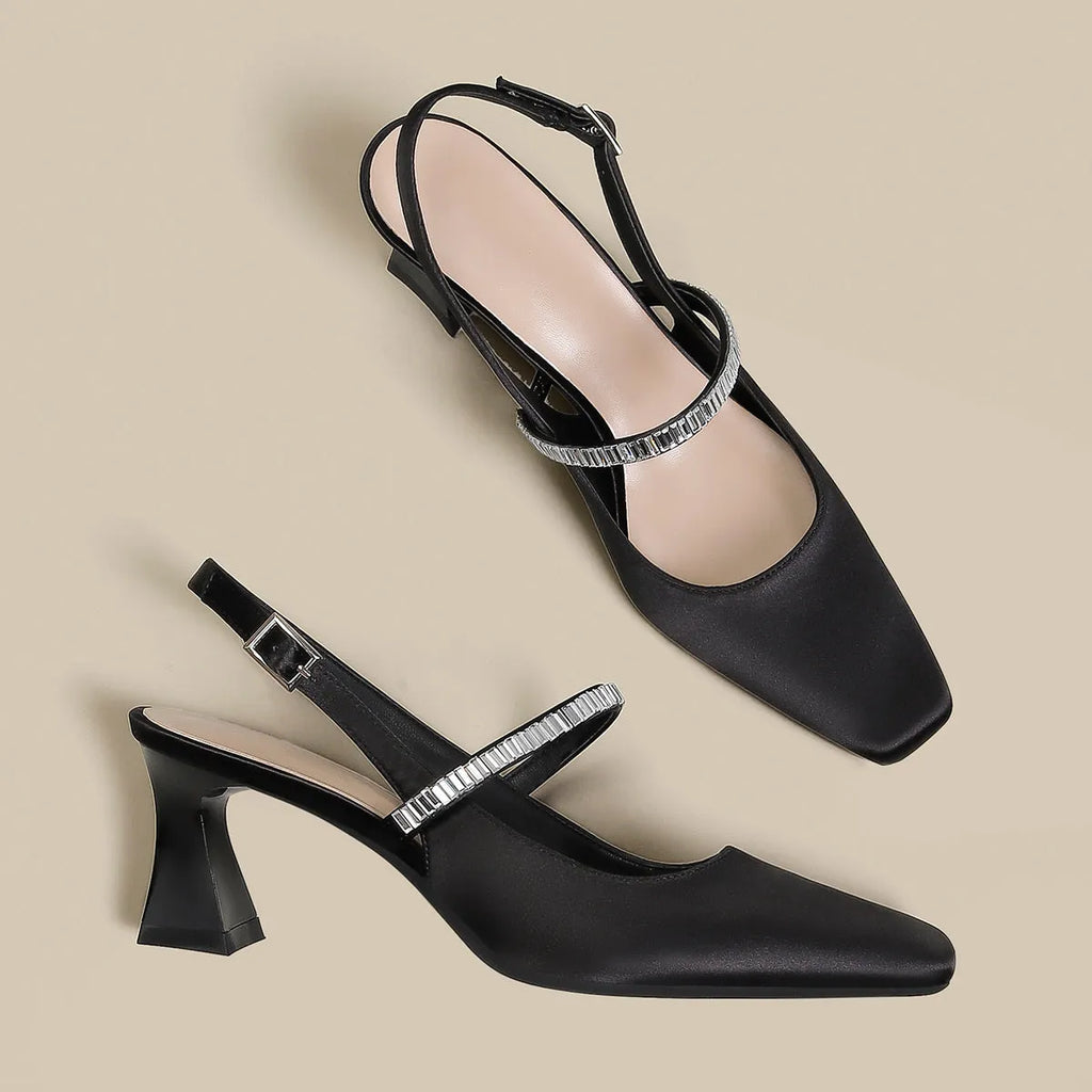 Women's black stiletto sandals with pointed closed toe and single buckle strap closure