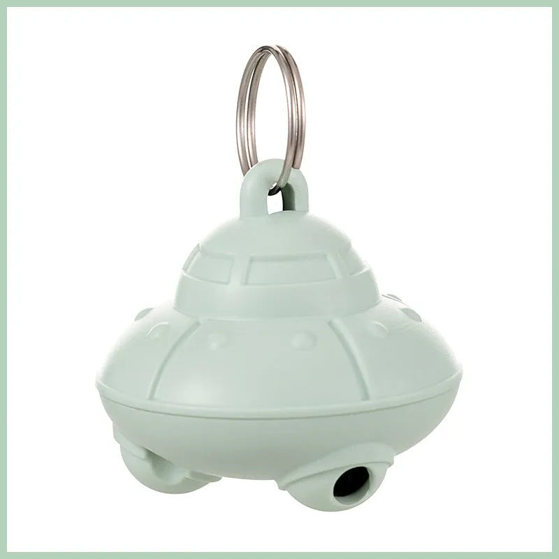 Green automatic cat laser toy attached to collar with USB charging port visible