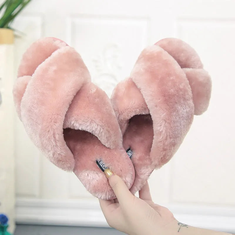 Women's cross open-toe fur slippers in assorted colours on a patterned non-slip sole.