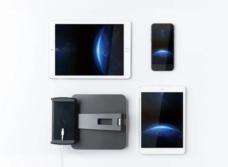 Silver foldable aluminium phone tablet holder on desk showing 360° rotation