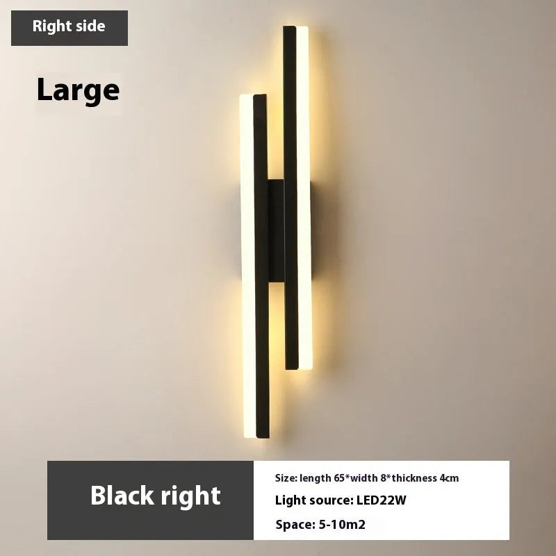 Scandinavian minimalist acrylic LED wall light in black or gold finish on a modern interior wall.
