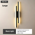Scandinavian minimalist acrylic LED wall light in black or gold finish on a modern interior wall.