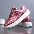 Rose gold sequin platform sneakers with round toe and thick MD sole on size label background