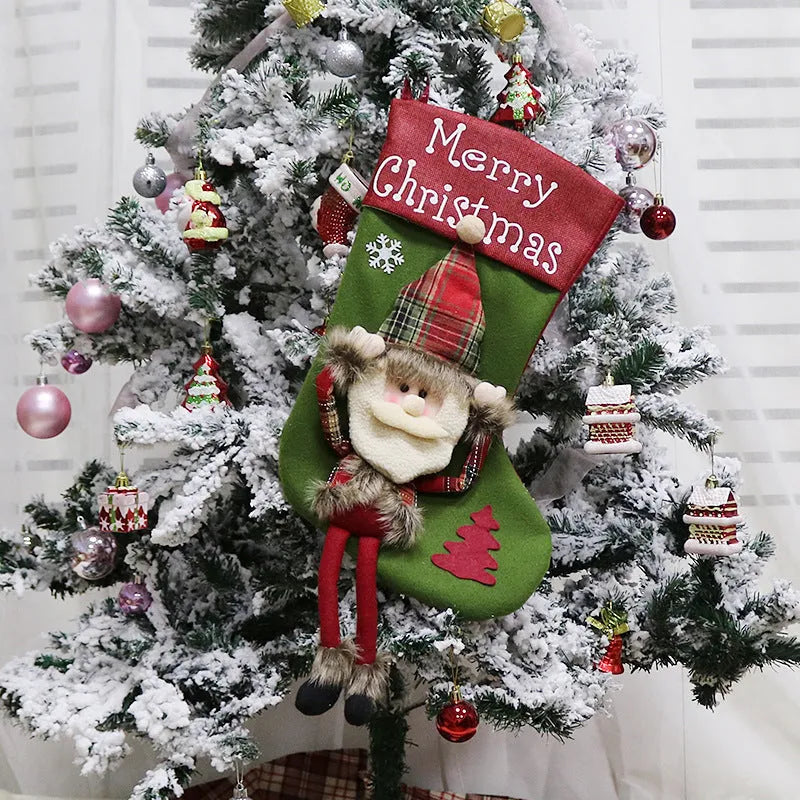 Set of three large red, white, and brown Christmas stockings featuring 3D Santa, Snowman, and Reindeer designs with hanging loops