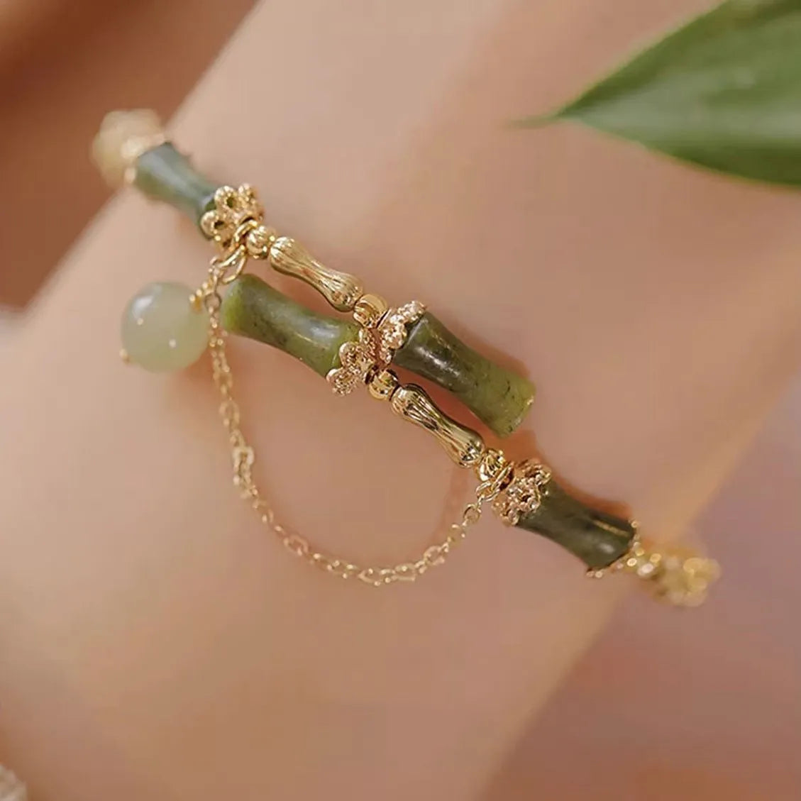 Women's bamboo bracelet with coloured glaze beads and a plum wine coloured bamboo joint centrepiece.