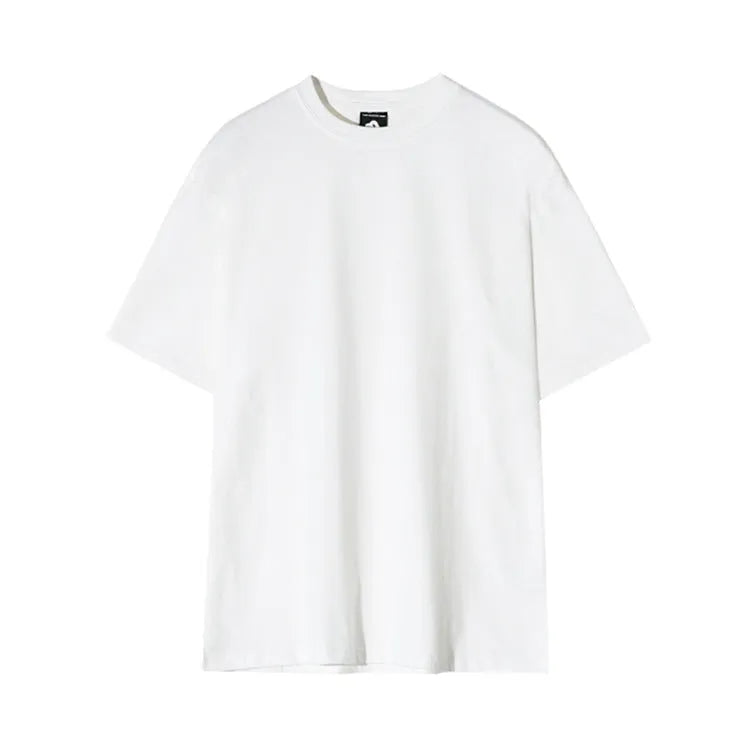 Men's slim fit cotton t-shirt in black with round neck and half sleeves on a model.