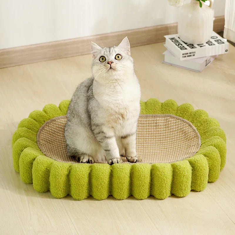 Green oval cat scratcher pad with sisal material and integrated cat bed bowl design