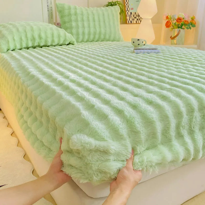 Class A milk fiber fitted sheet with rabbit plush in clear blue, showing elastic edges and smooth surface
