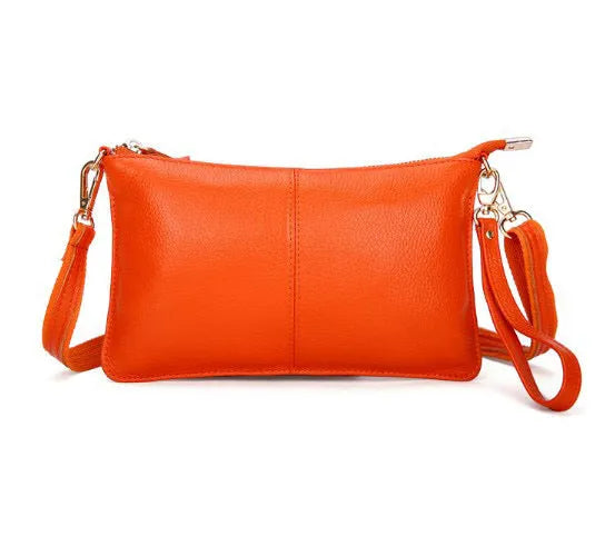 A cowhide lady slant bag in a chosen colour, showing hand and shoulder straps, with dimensions of 24 cm by 14 cm.