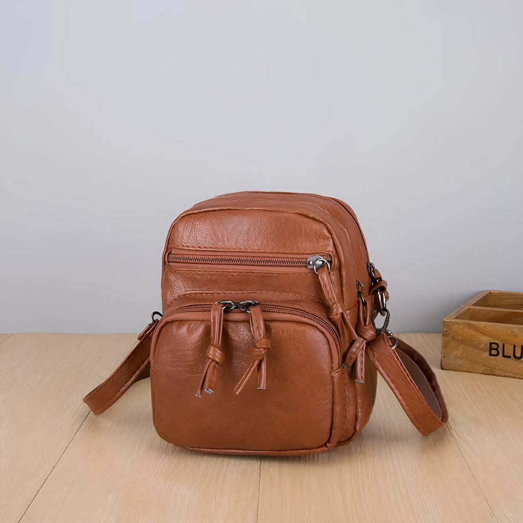 Soft PU leather mini shoulder bag with chain detail in black and brown colour options