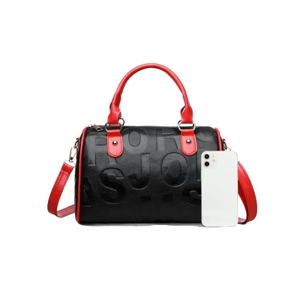 Brown cylindrical crossbody bag with three shoulder straps showing authentic leather texture