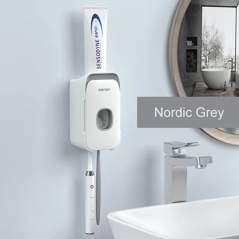 Automatic toothpaste dispenser in blue colour mounted on a bathroom wall