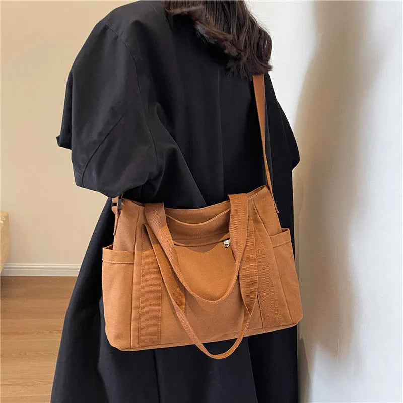 Large capacity polyester canvas shoulder tote bag with internal phone compartment in solid colour