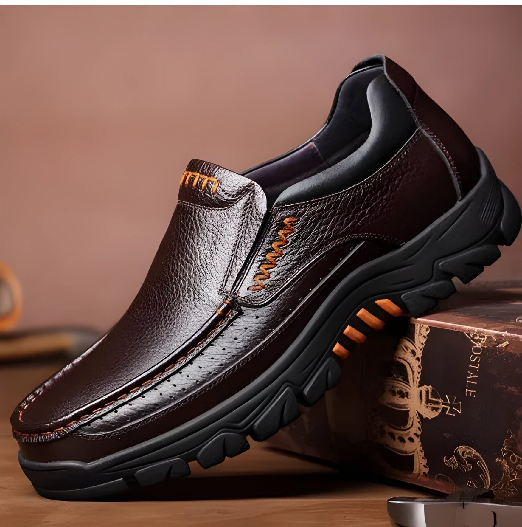 A pair of men's black slip-on business casual shoes made from cowhide leather with a rubber sole.