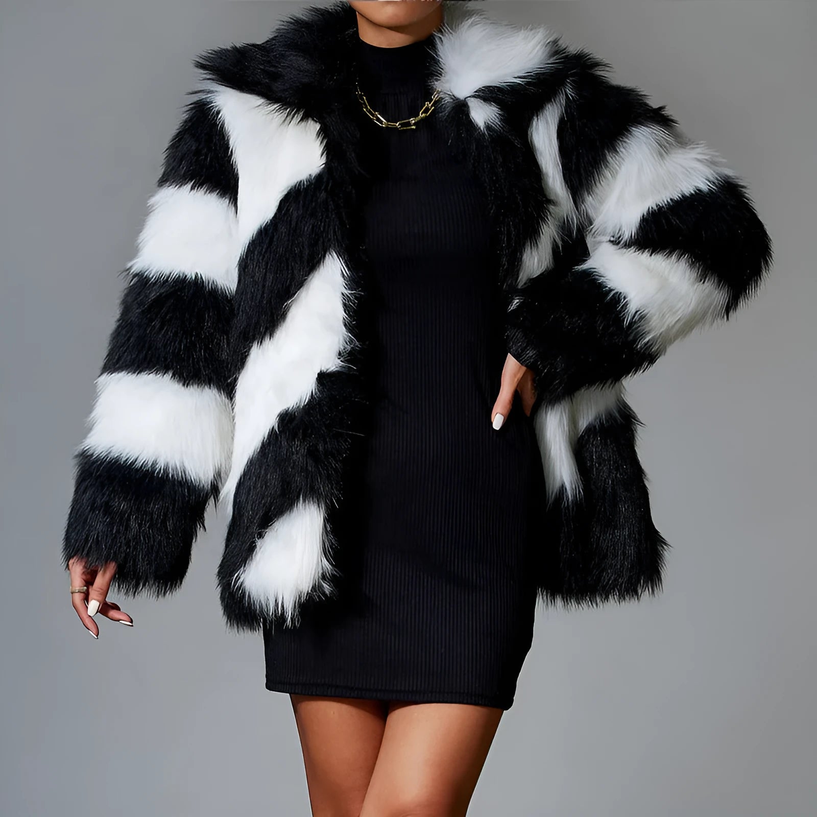 A picture colour faux fur coat with a contrast lapel and a textured fur collar, shown on a hanger.