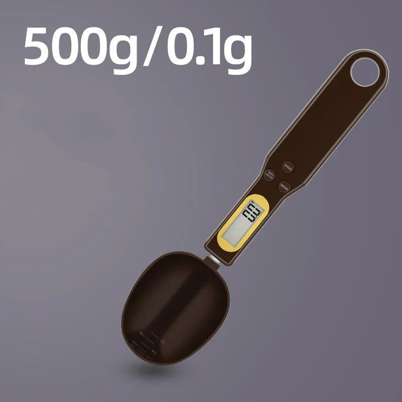 Black digital measuring spoon scale showing 0.0g display on LCD screen with 500g capacity