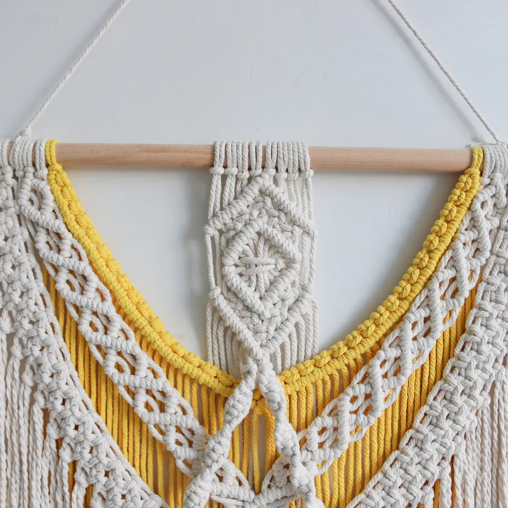 Creamy white hand-woven cotton Nordic tapestry hanging on a wall, rectangular shape 120cm by 95cm.