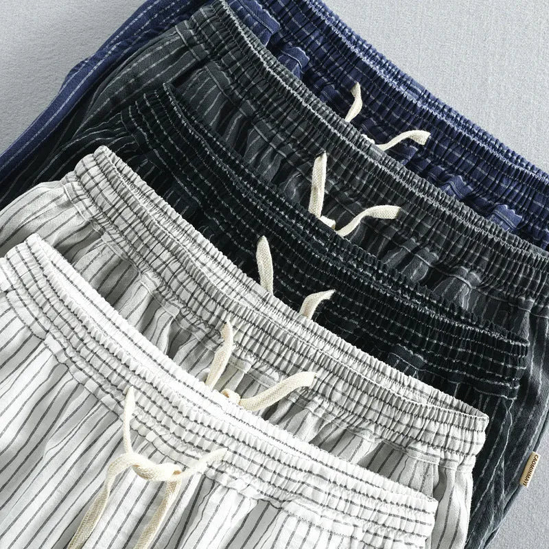 Men's striped cotton casual shorts with an elastic waistband in light blue.