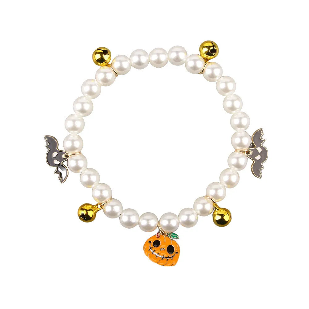 Halloween cat collar decorated with simulated pearls in a pumpkin design on a pet