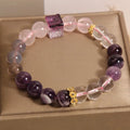 Purple women's bracelet with natural amethyst stones and rhinestones on a 10mm wide crystal band.