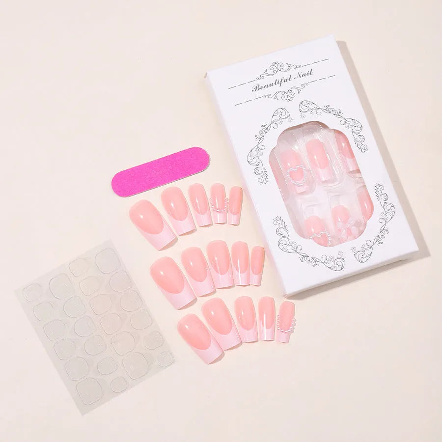 French Love Pearl fake nail stickers in colour XD93 with love pattern, shown with jelly glue and polish rub cloth.