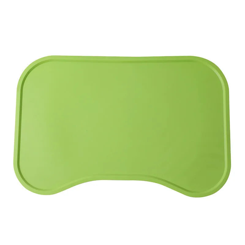 Waterproof silicone dog food mat with raised edges in green colour, non-slip base for pet bowls