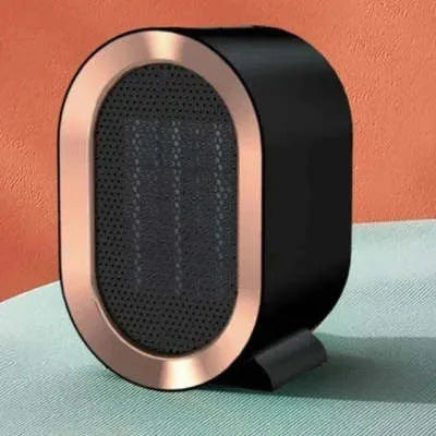 Compact black desktop electric fan heater with a front grille and mechanical control dials.